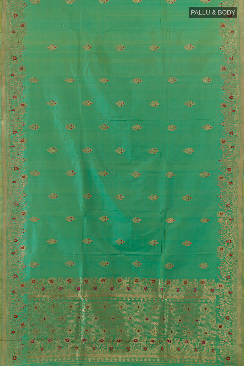 Flat view of Pure Silk Green Banarasi Saree with Zari Butta on the body and Zari Border. 