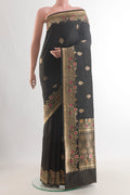 Pure Silk Black Banarasi Katan Saree with Zari Butta on the body and Zari Border.  displayed on a mannequin