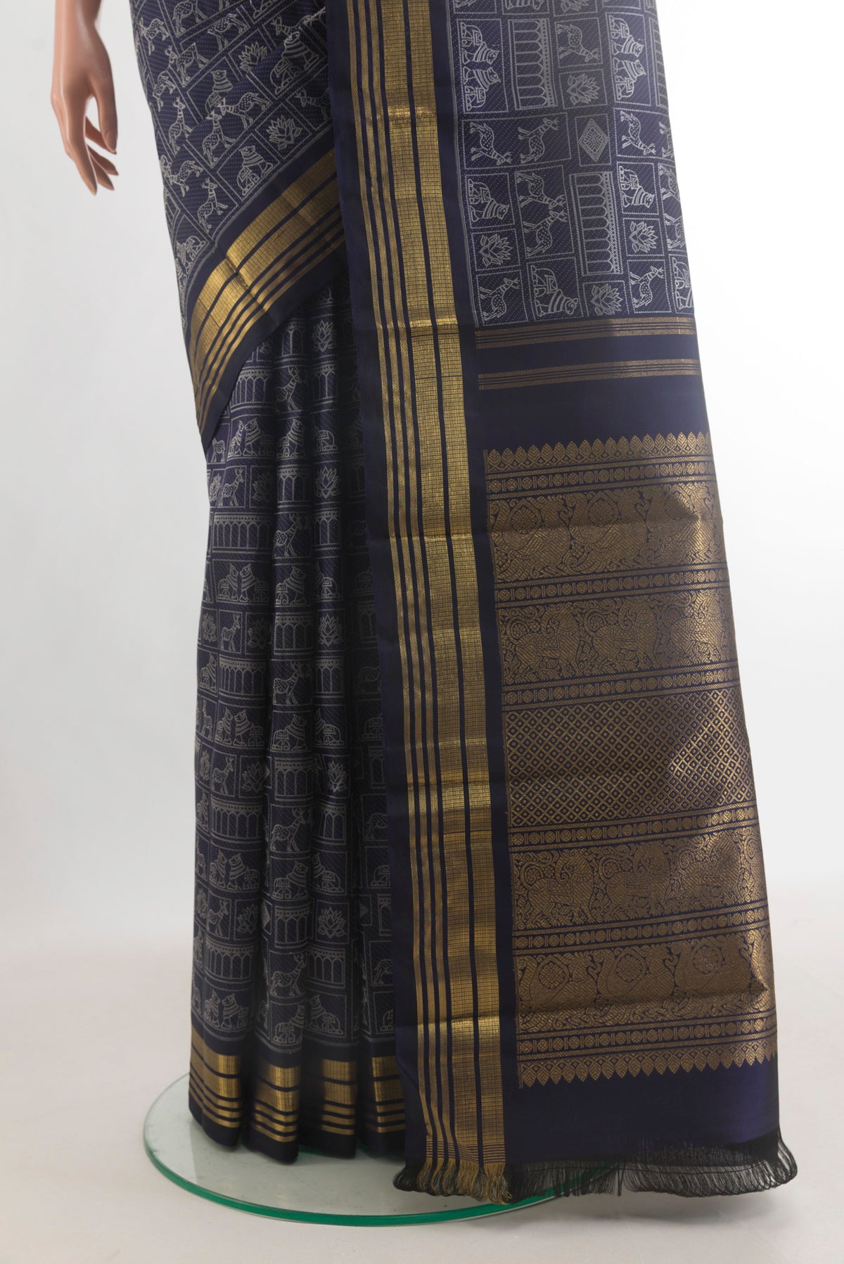 Pleats and pallu of Pure Silk Pure Zari Navy Blue Kanchipuram Saree with Jacquard design on the body and Zari Border. 