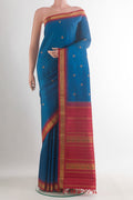Pure Silk Pure Zari Blue Kanjivaram Saree with Zari Butta on the body and Zari Border.  displayed on a mannequin