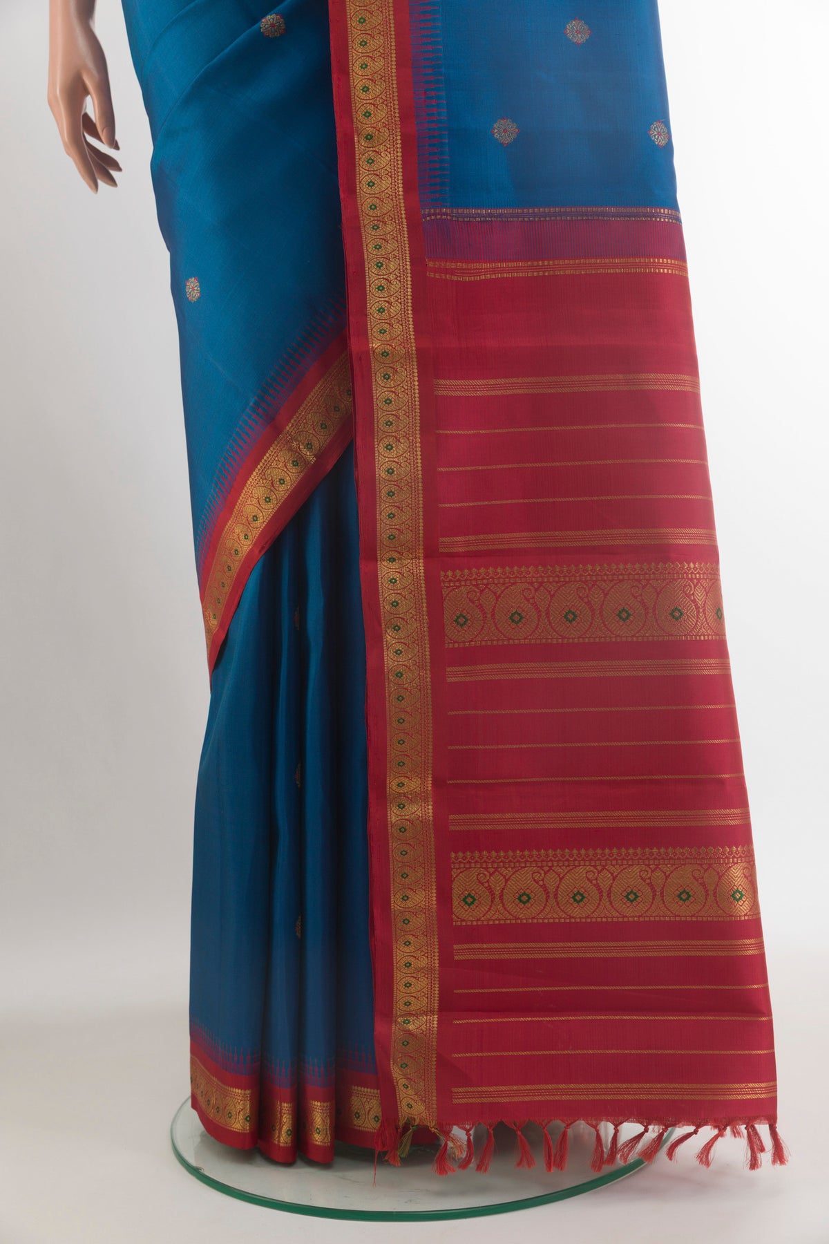 Pleats and pallu of Pure Silk Pure Zari Blue Kanjivaram Saree with Zari Butta on the body and Zari Border. 