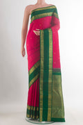 Pure Silk Pure Zari Pink Kanjivaram Saree with Zari Butta on the body and Zari Border.  displayed on a mannequin