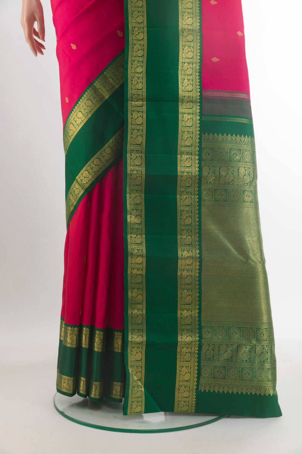 Pleats and pallu of Pure Silk Pure Zari Pink Kanjivaram Saree with Zari Butta on the body and Zari Border. 