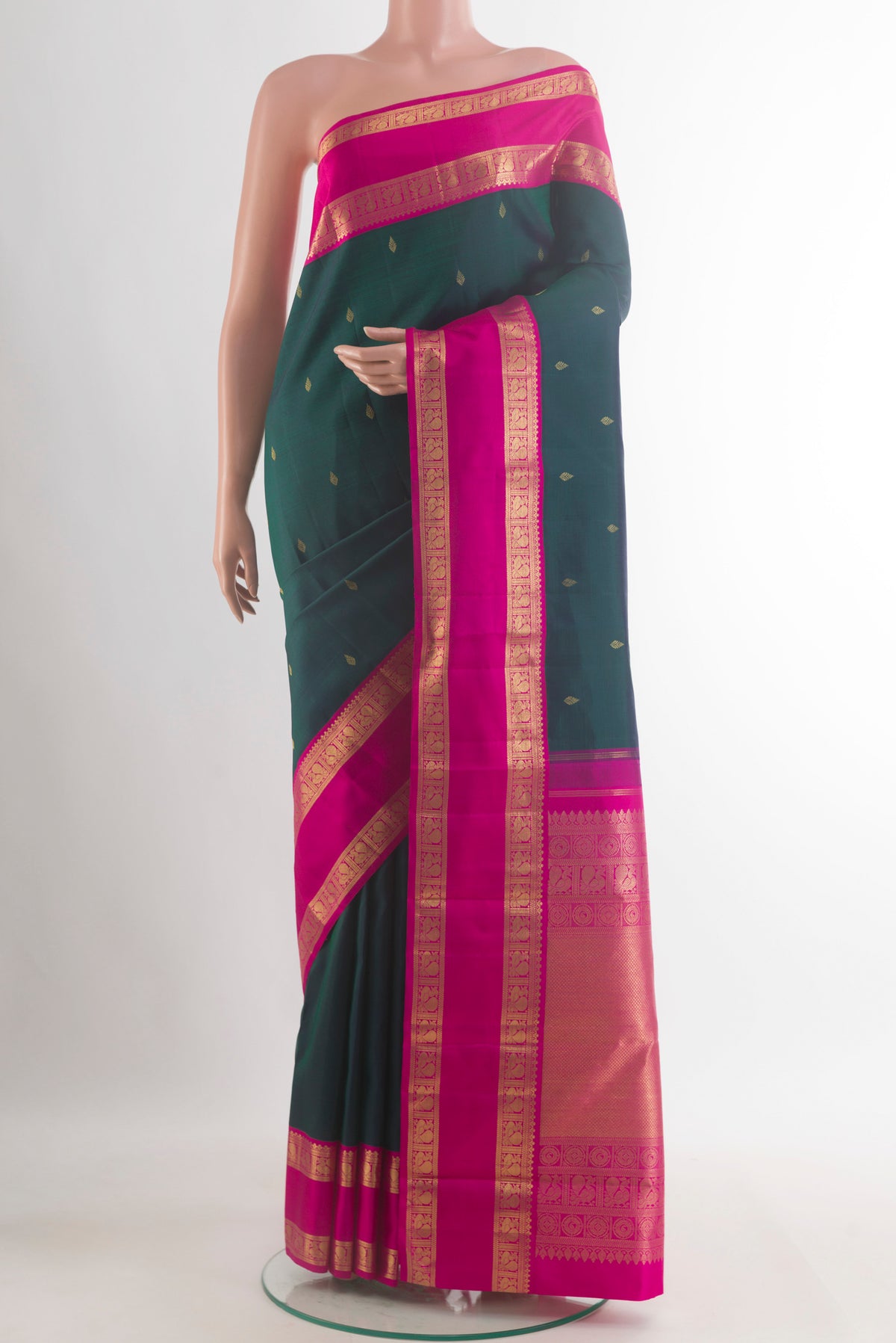 Pure Silk Pure Zari Green Kanjivaram Saree with Zari Butta on the body and Zari Border.  displayed on a mannequin