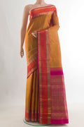 Pure Silk Pure Zari Mustard Kanjivaram Saree with Zari Butta on the body and Zari Border.  displayed on a mannequin