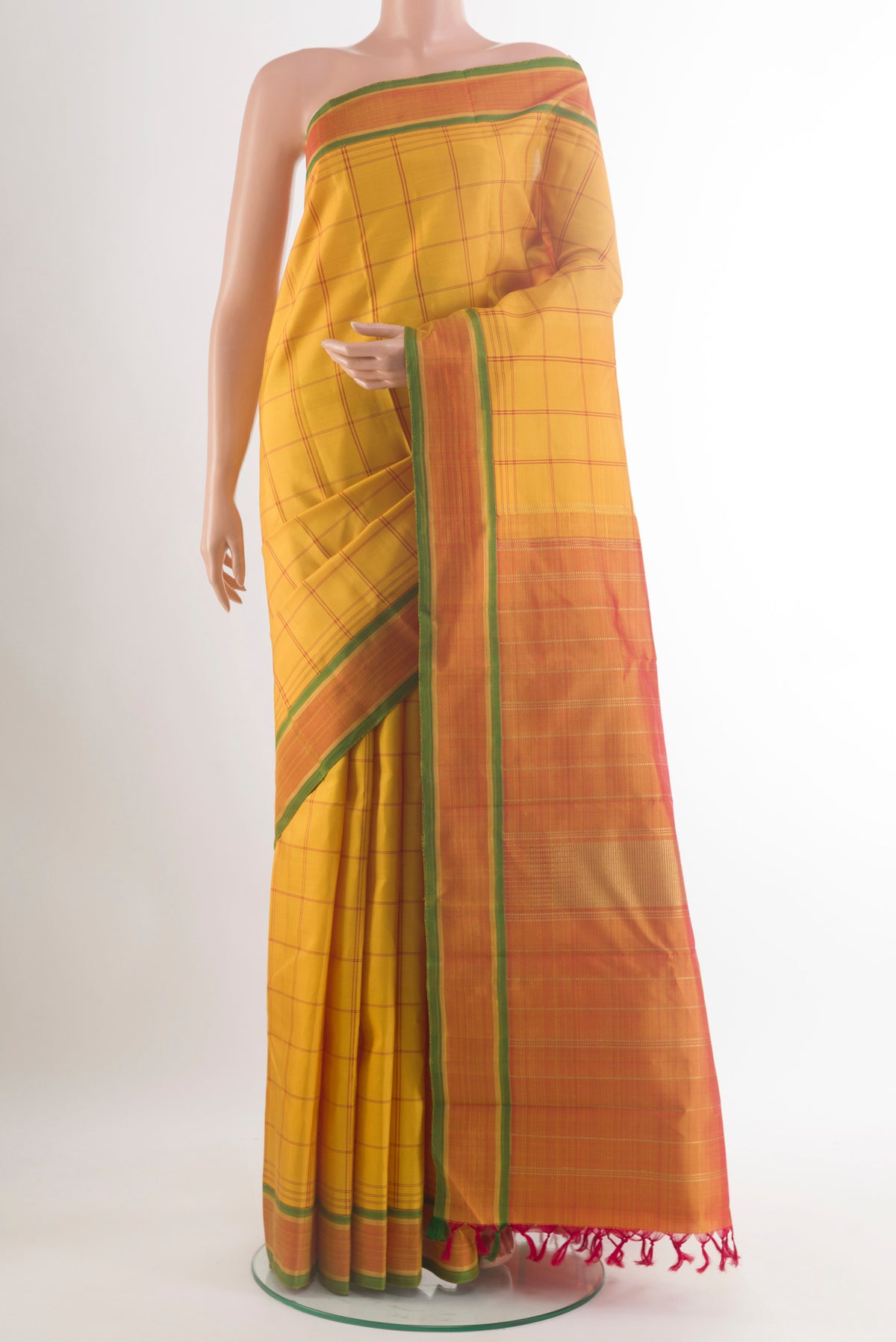 Pure Silk Yellow Kanjivaram Saree with Checked design on the body and Plain Border.  displayed on a mannequin