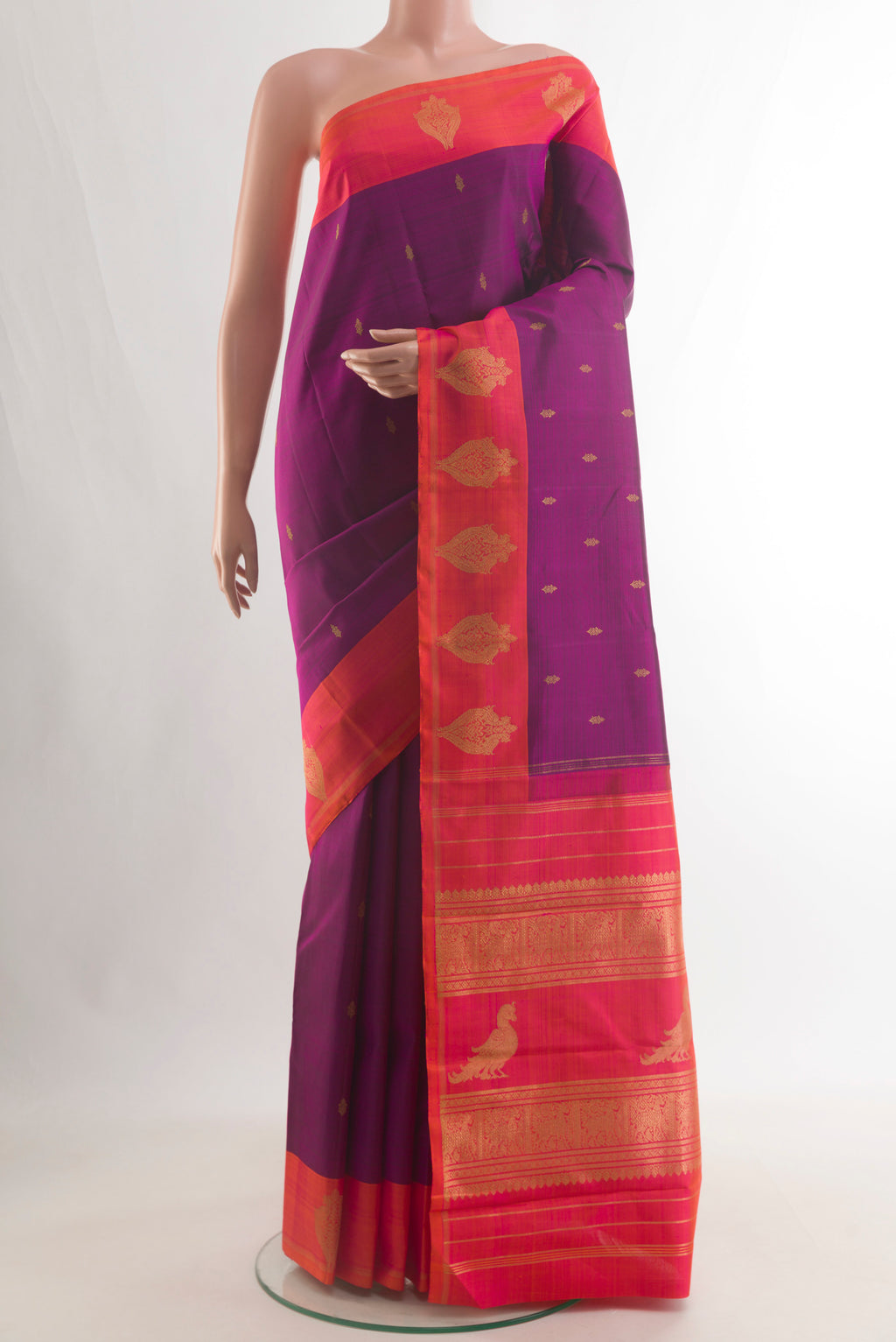 Pure Silk Purple Kanchipuram Saree with Zari Butta on the body and Zari Border.  displayed on a mannequin