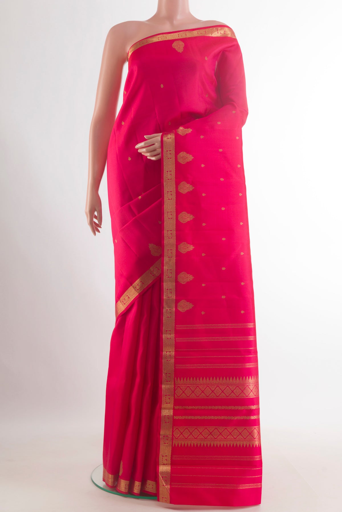 Pure Silk Pure Zari Pink Kanchipuram Saree with Zari Butta on the body and Zari Border.  displayed on a mannequin