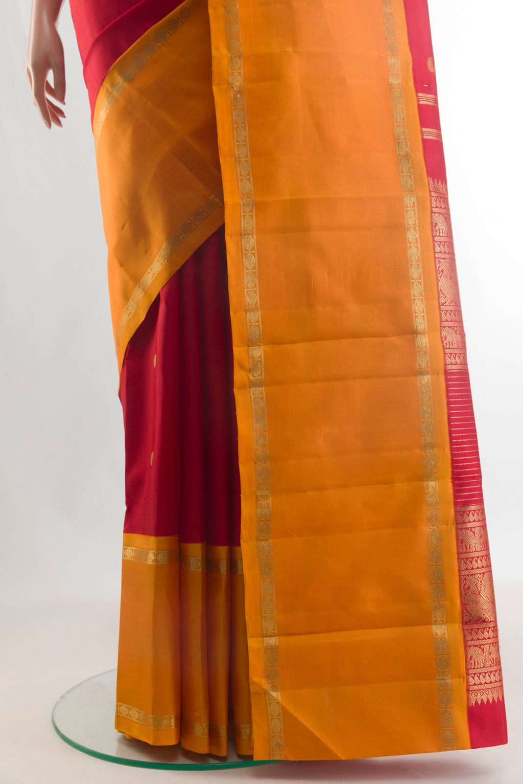 Pleats and pallu of Pure Silk Pure Zari Red Kanjivaram Saree with Zari Butta on the body and Ganga Jamuna Border. 