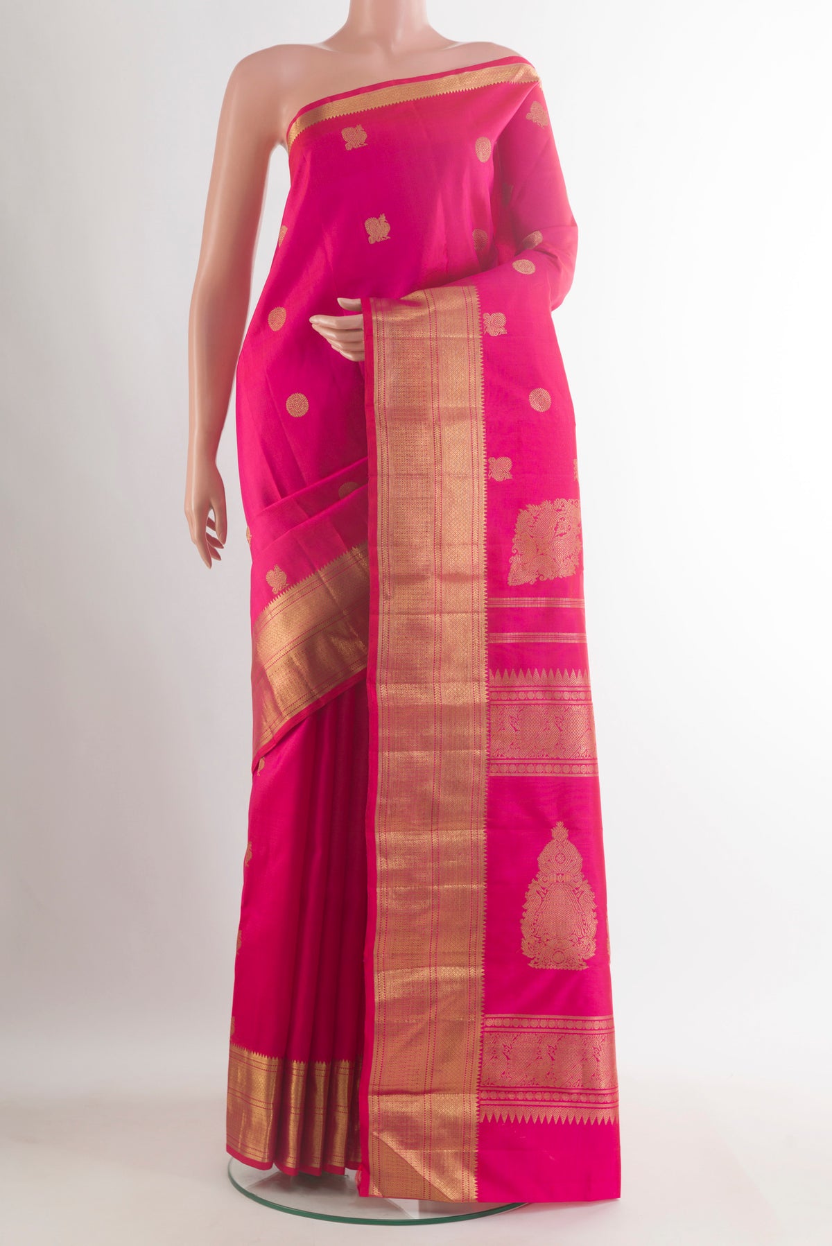 Pure Silk Pure Zari Pink Kanjivaram Saree with Zari Butta on the body and Zari Border.  displayed on a mannequin