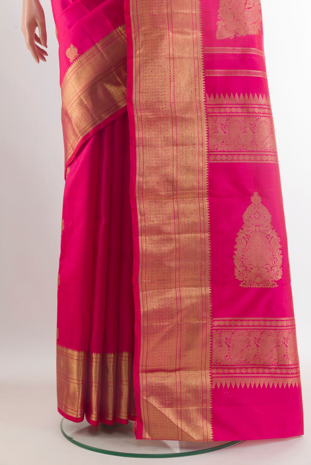 Pleats and pallu of Pure Silk Pure Zari Pink Kanjivaram Saree with Zari Butta on the body and Zari Border. 