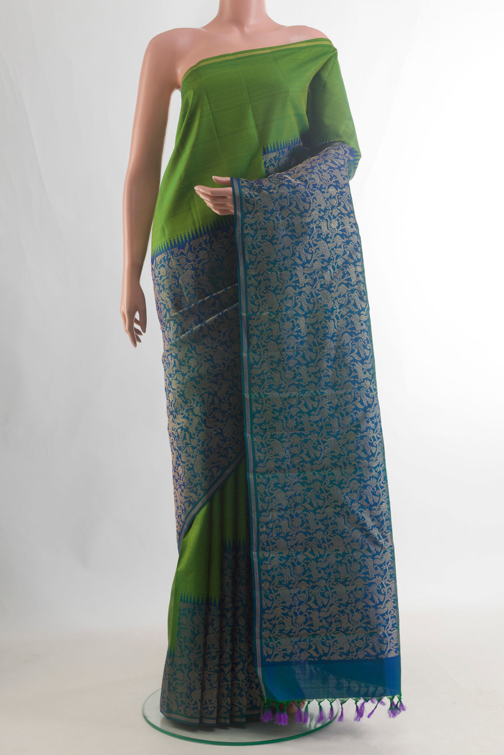 Pure Silk Pure Zari Peacock Blue Kanjivaram Saree with Zari Brocade on the body and Zari Border.  displayed on a mannequin