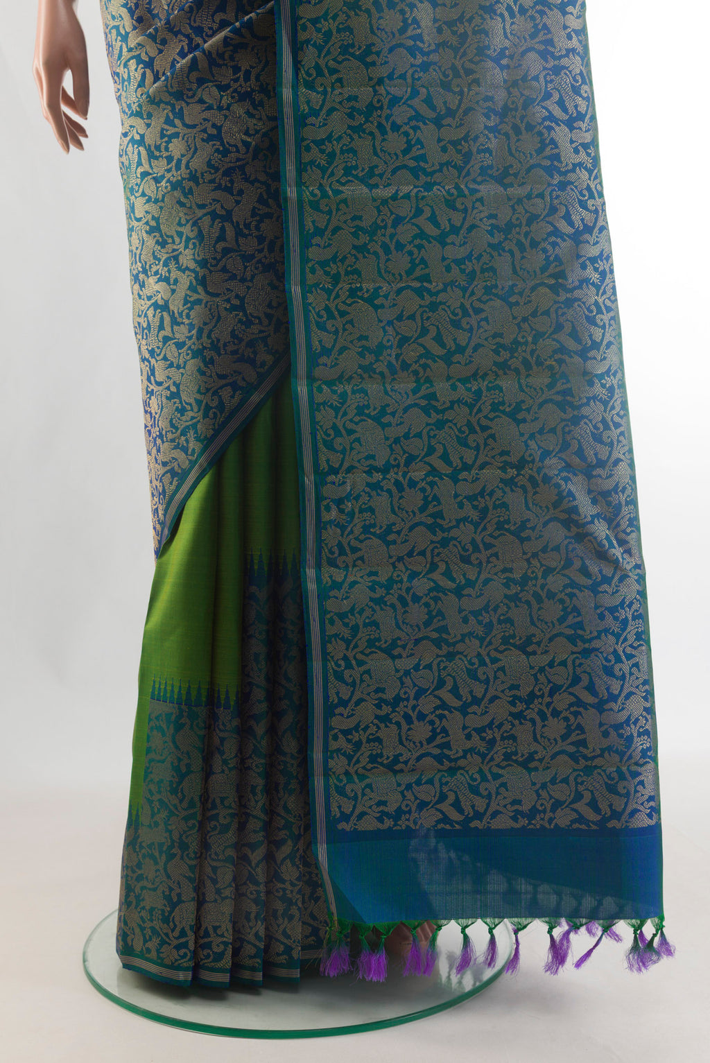 Pleats and pallu of Pure Silk Pure Zari Peacock Blue Kanjivaram Saree with Zari Brocade on the body and Zari Border. 