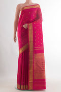 Pure Silk Pure Zari Dark Pink Kanjivaram Saree with Zari Butta on the body and Zari Border.  displayed on a mannequin