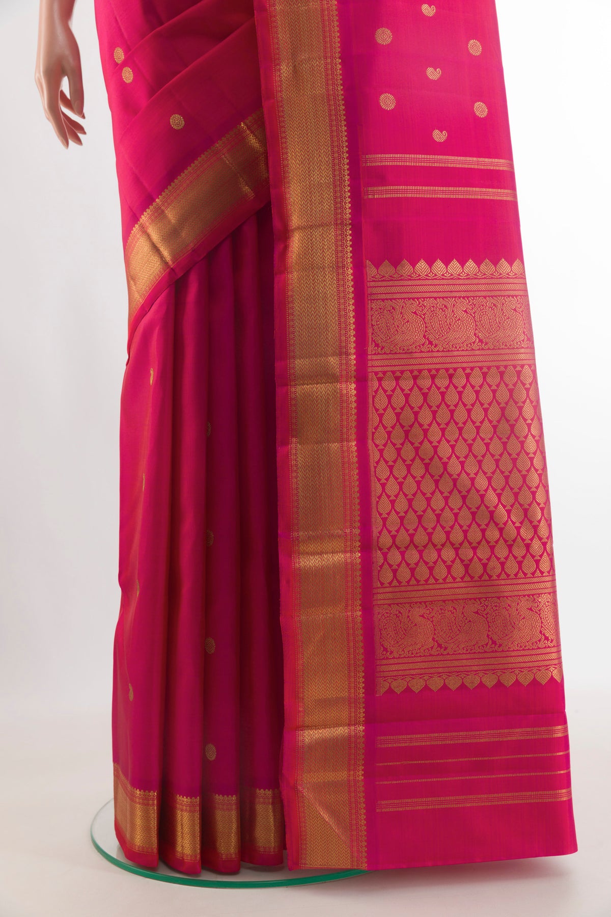 Pleats and pallu of Pure Silk Pure Zari Dark Pink Kanjivaram Saree with Zari Butta on the body and Zari Border. 