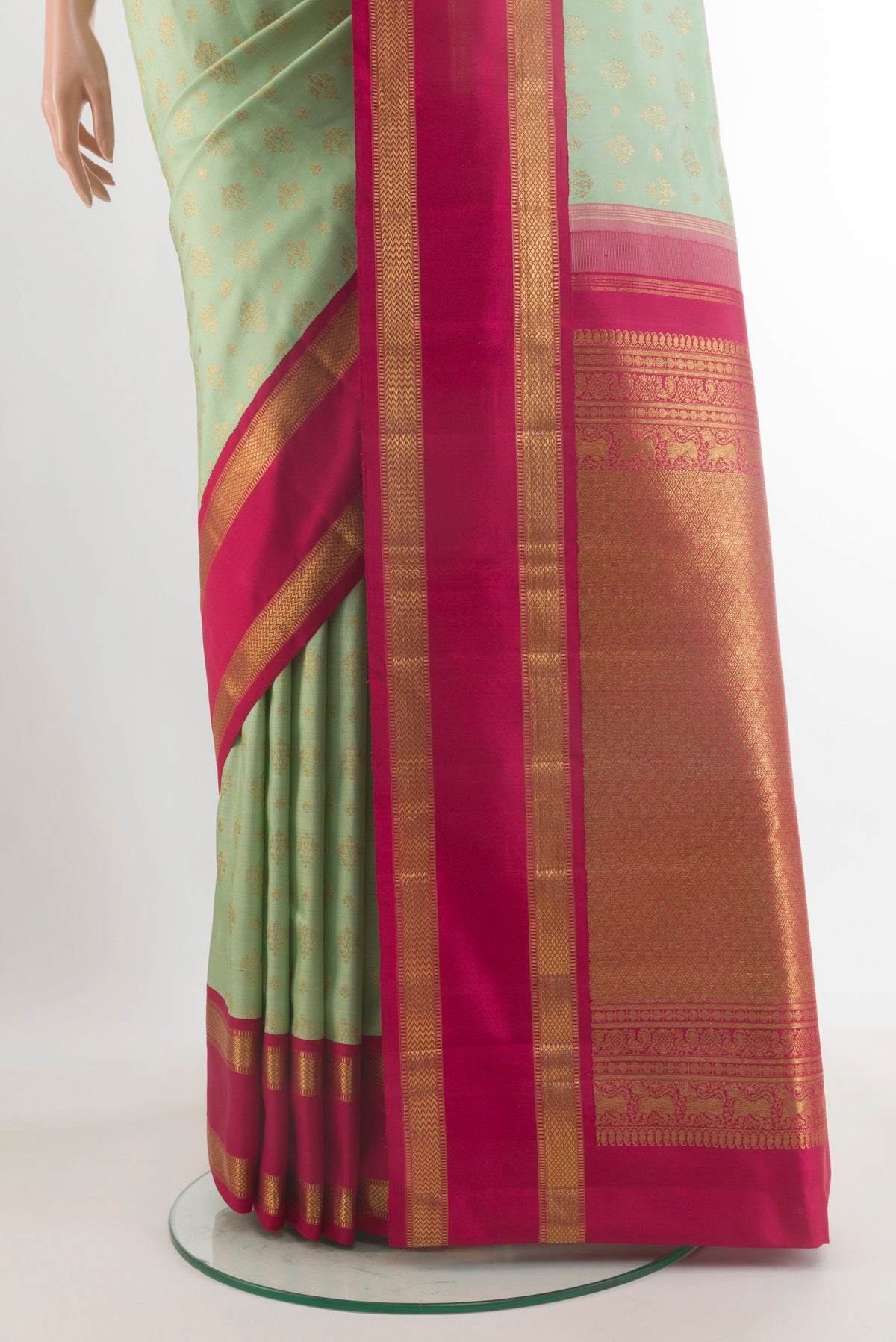 Pleats and pallu of Pure Silk Pure Zari Mint Green Kanjivaram Saree with Zari Butta on the body and Zari Border. 