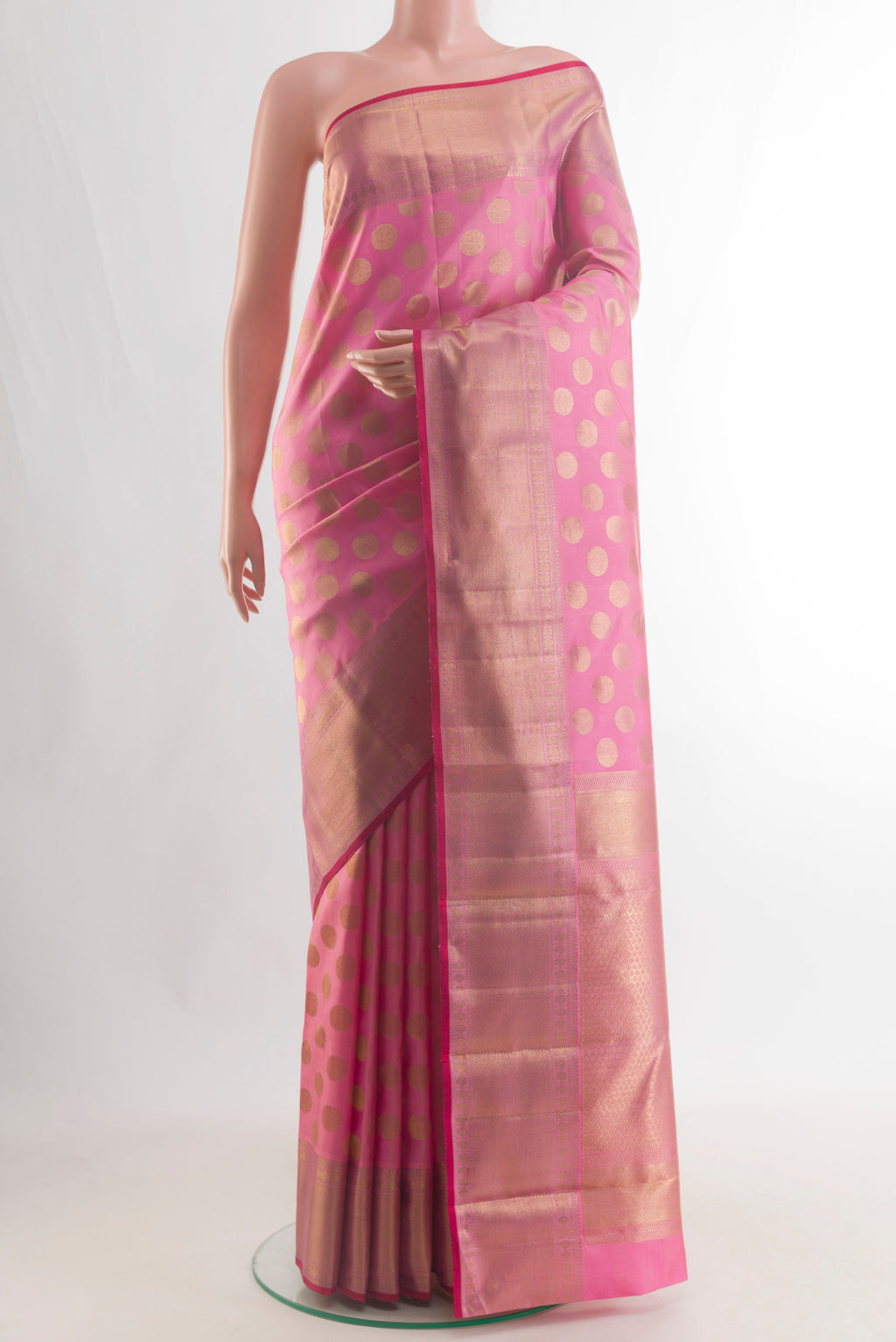 Pure Silk Pink Kanchipuram Saree with Zari Butta on the body and Zari Border.  displayed on a mannequin