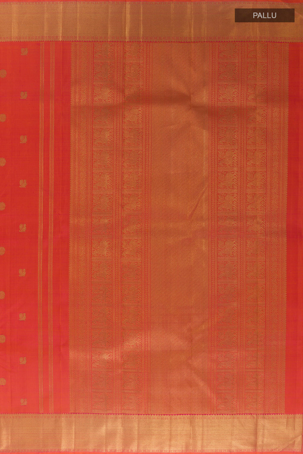 Close up image of the pallu of Pure Silk Pure Zari Brick Orange Kanjivaram Saree with Zari Butta on the body and Zari Border. 