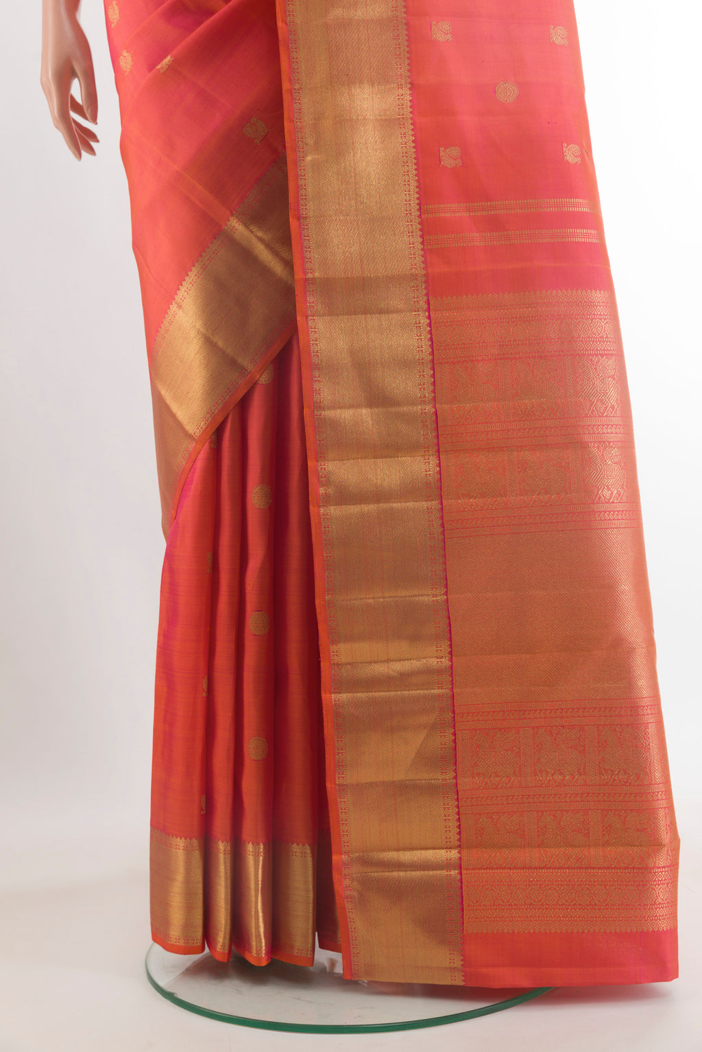 Pleats and pallu of Pure Silk Pure Zari Brick Orange Kanjivaram Saree with Zari Butta on the body and Zari Border. 