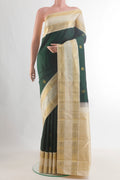 Pure Silk Pure Zari Bottle Green Kanjivaram Saree with Zari Butta on the body and Zari Border.  displayed on a mannequin
