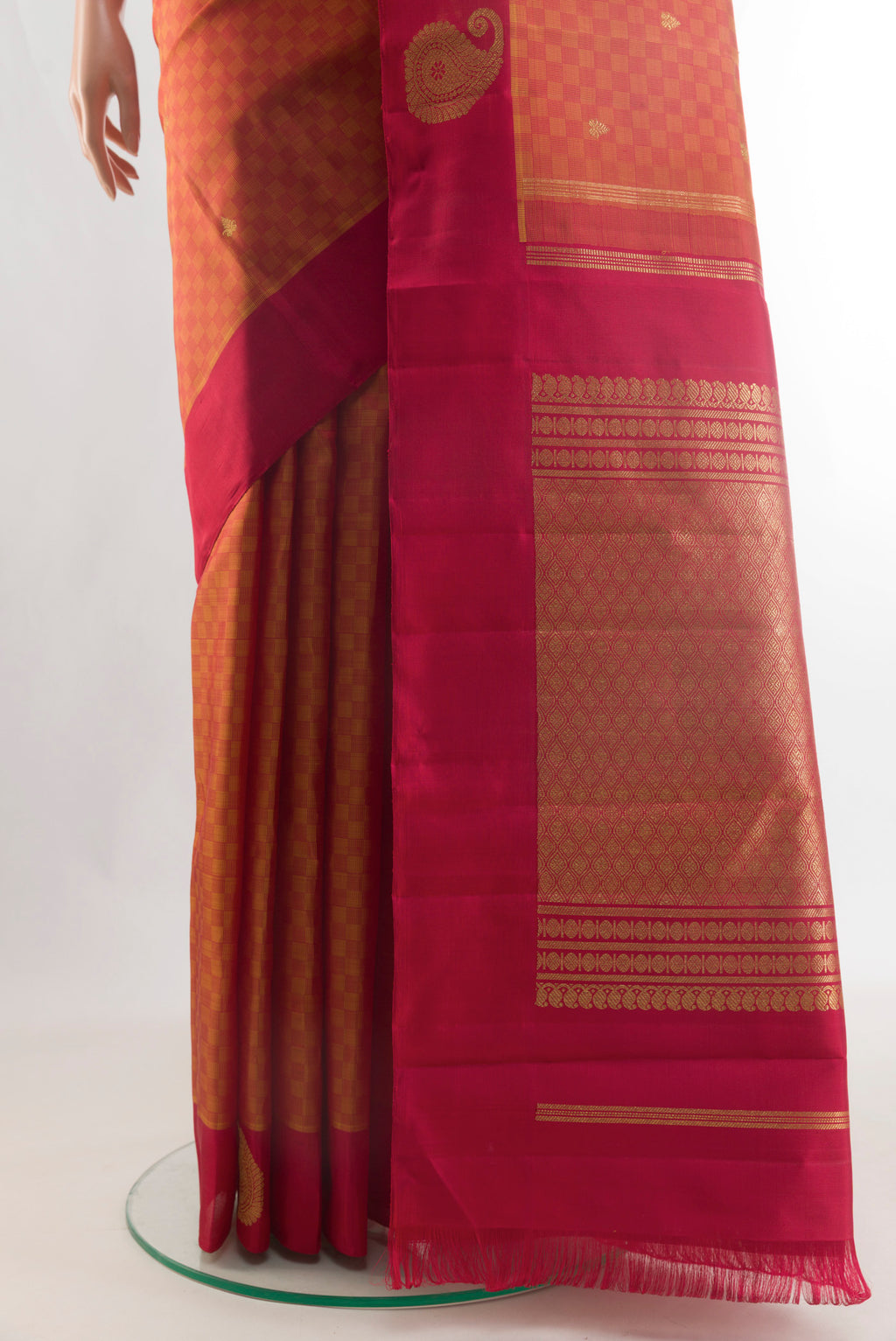 Pleats and pallu of Pure Silk Pure Zari Rust Kanchipuram Saree with Jacquard With Zari Butta on the body and Zari Border. 