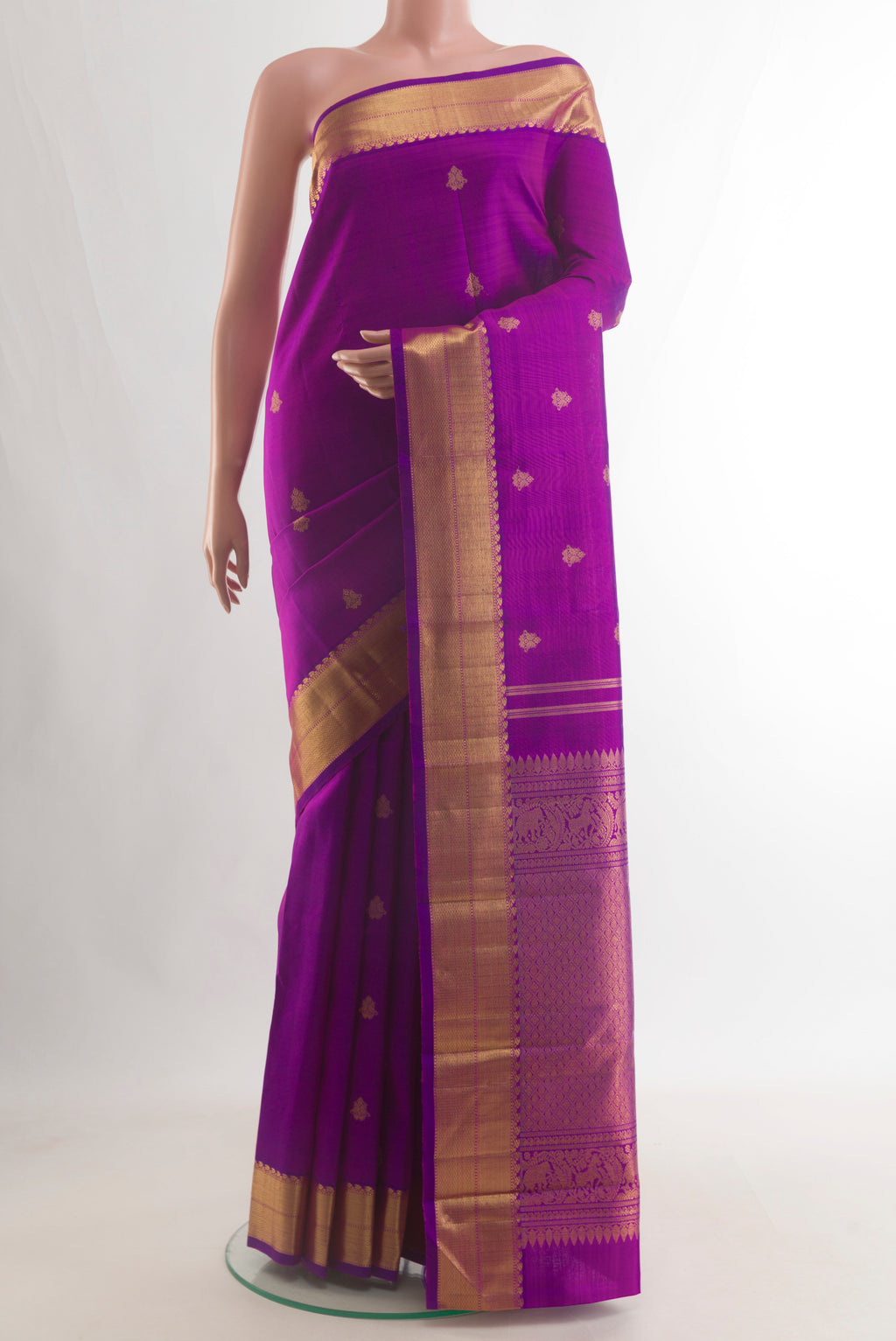 Pure Silk Pure Zari Purple Kanjivaram Saree with Zari Butta on the body and Zari Border.  displayed on a mannequin