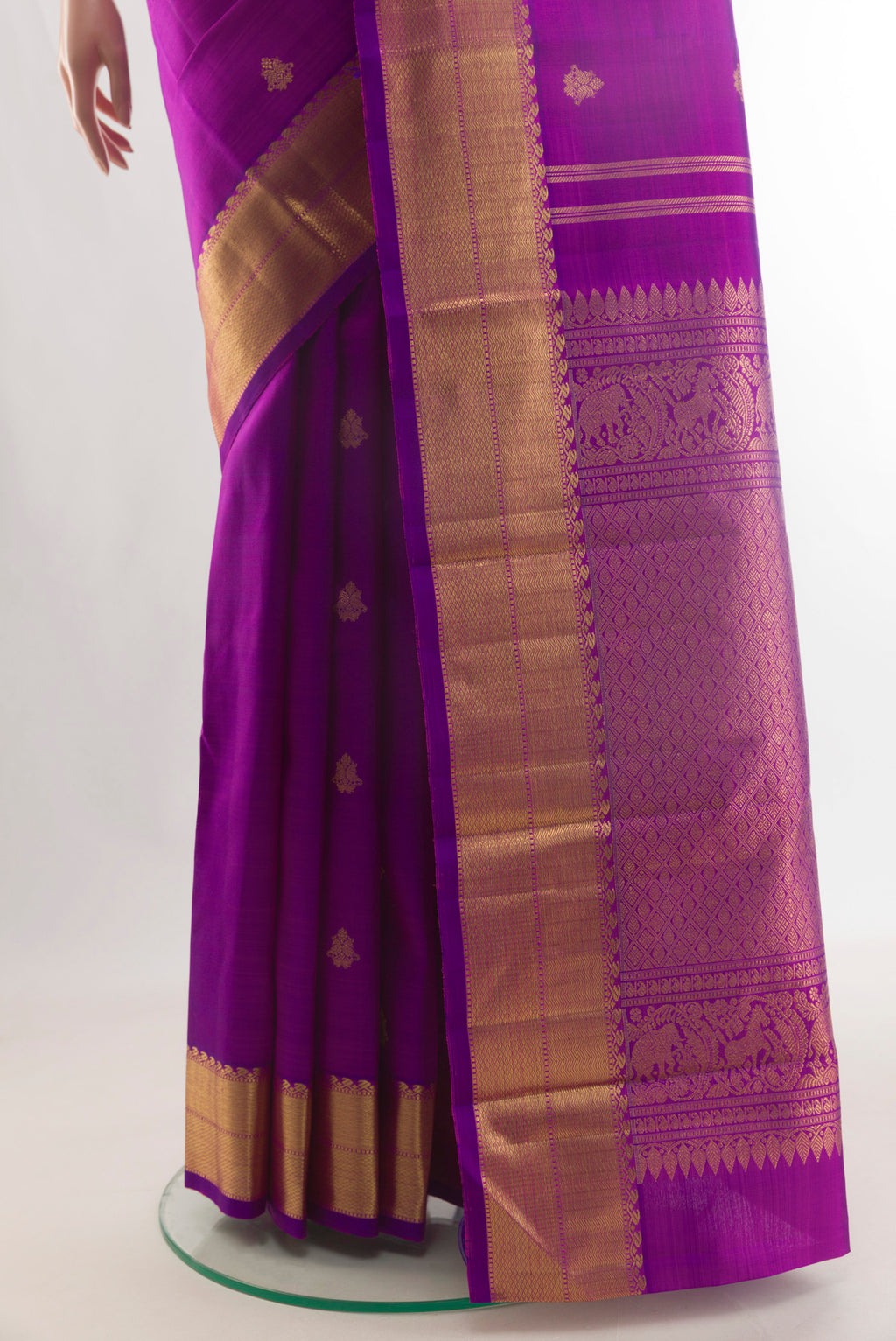 Pleats and pallu of Pure Silk Pure Zari Purple Kanjivaram Saree with Zari Butta on the body and Zari Border. 