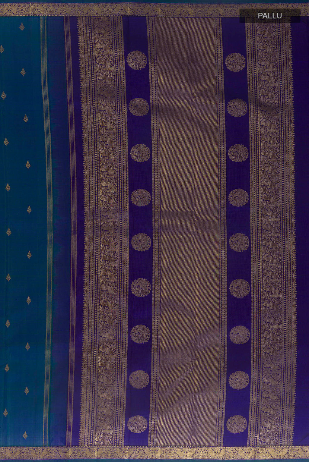Close up image of the pallu of Pure Silk Pure Zari Peacock Blue Kanchipuram Saree with Zari Butta on the body and Zari Border. 