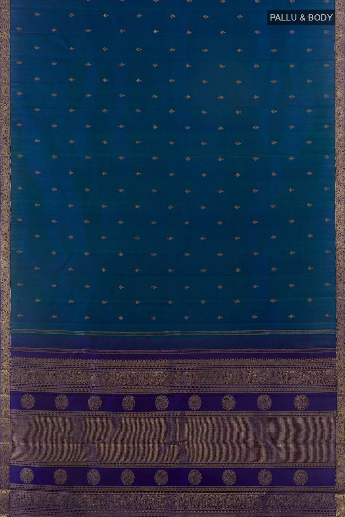 Flat view of Pure Silk Pure Zari Peacock Blue Kanchipuram Saree with Zari Butta on the body and Zari Border. 