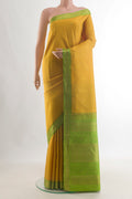 Pure Silk Pure Zari Yellow Kanjivaram Saree with Zari Butta on the body and Zari Border.  displayed on a mannequin