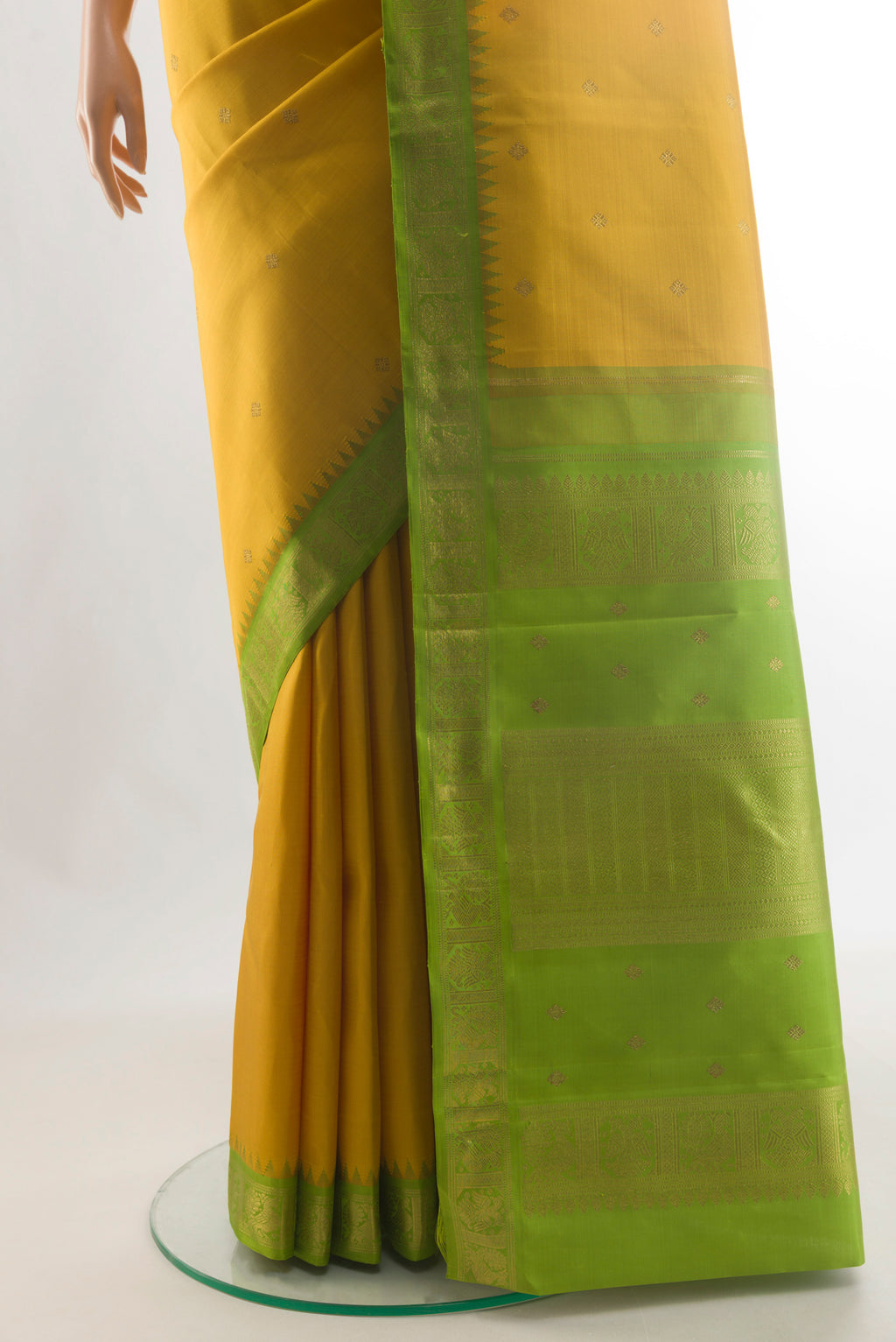 Pleats and pallu of Pure Silk Pure Zari Yellow Kanjivaram Saree with Zari Butta on the body and Zari Border. 