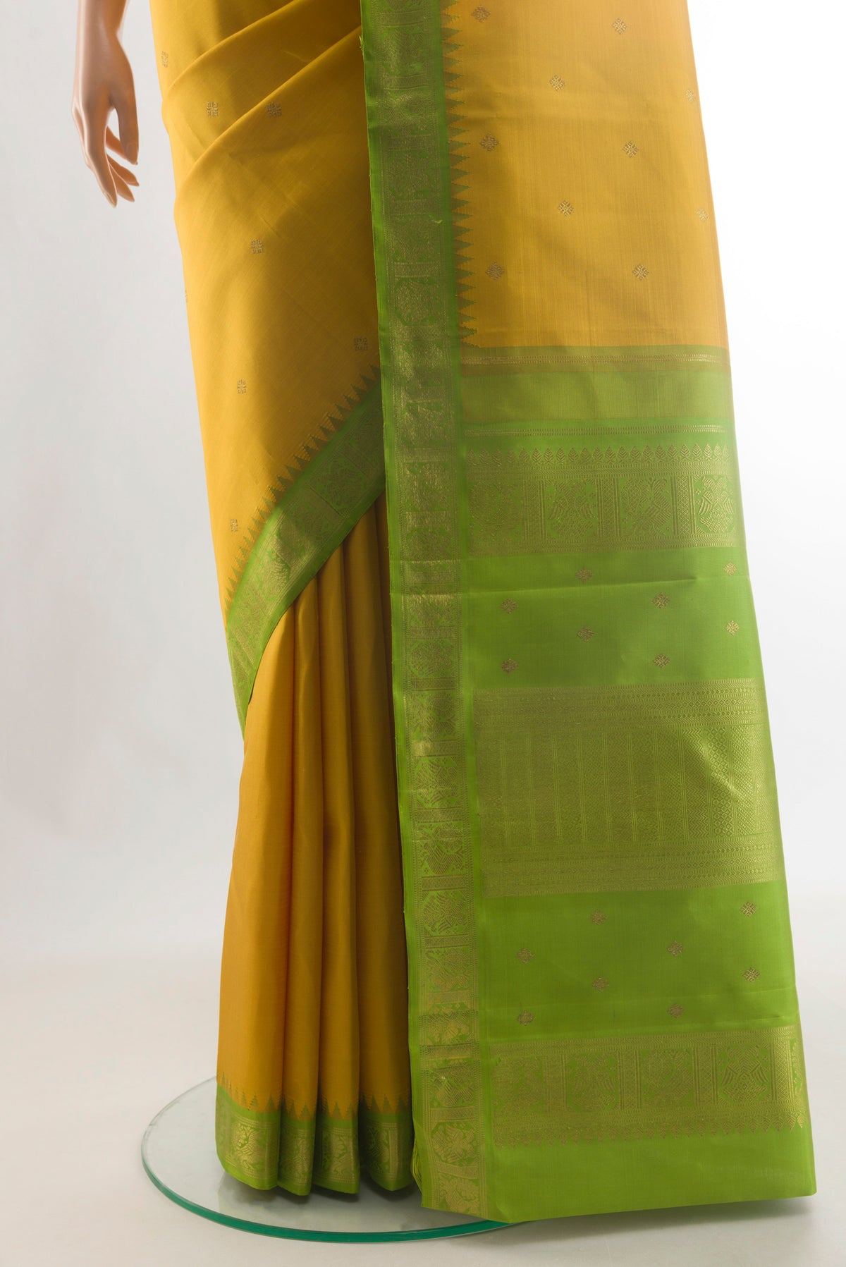 Pleats and pallu of Pure Silk Pure Zari Yellow Kanjivaram Saree with Zari Butta on the body and Zari Border. 