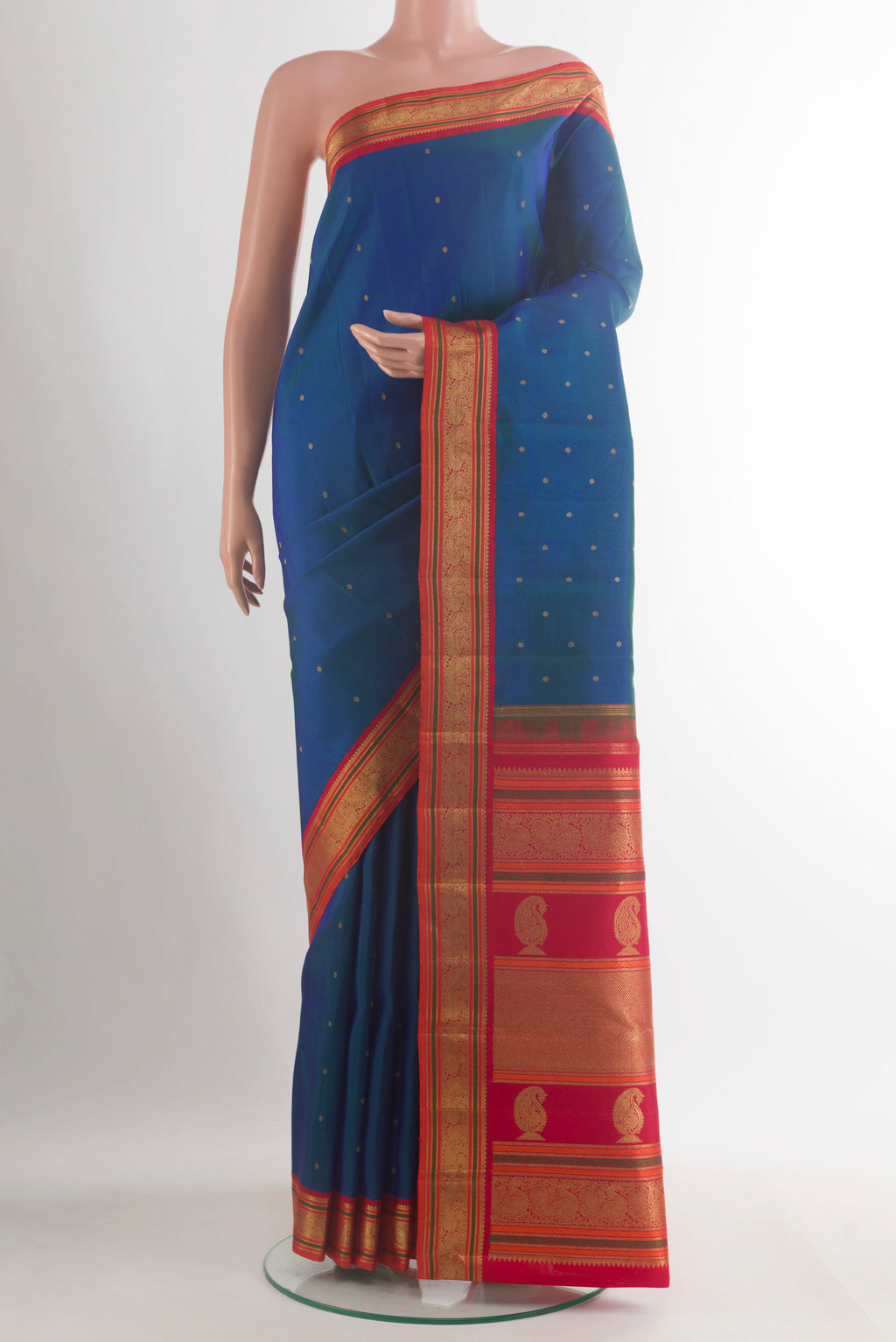 Pure Silk Pure Zari Blue Kanjivaram Saree with Zari Butta on the body and Zari Border.  displayed on a mannequin
