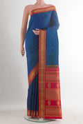 Pure Silk Pure Zari Blue Kanjivaram Saree with Zari Butta on the body and Zari Border.  displayed on a mannequin