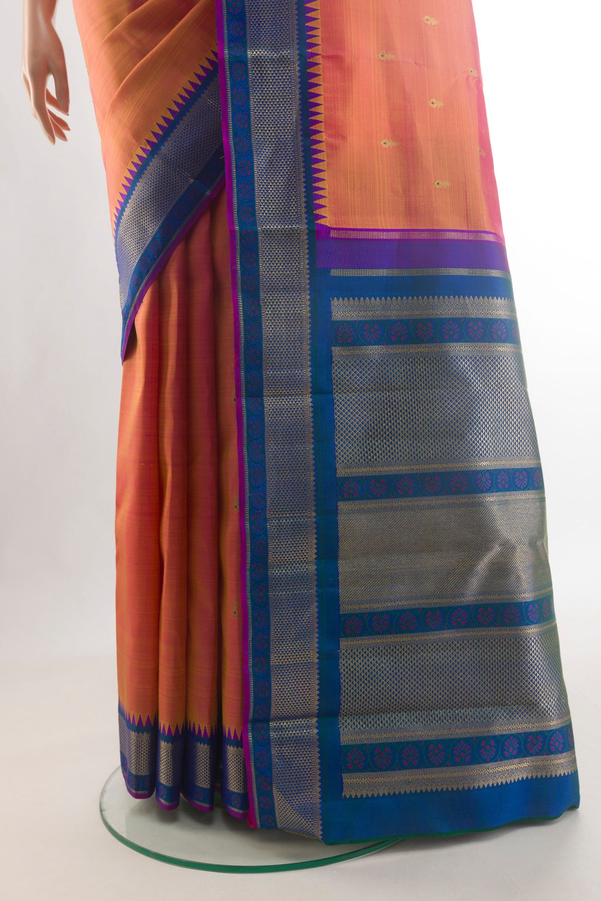 Pleats and pallu of Pure Silk Pure Zari Peach Kanjivaram Saree with Zari Butta on the body and Zari Border. 