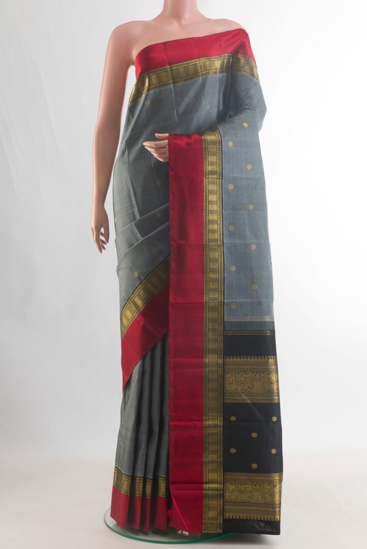 Pure Silk Pure Zari Grey Kanjivaram Saree with Zari Butta on the body and Zari Border.  displayed on a mannequin