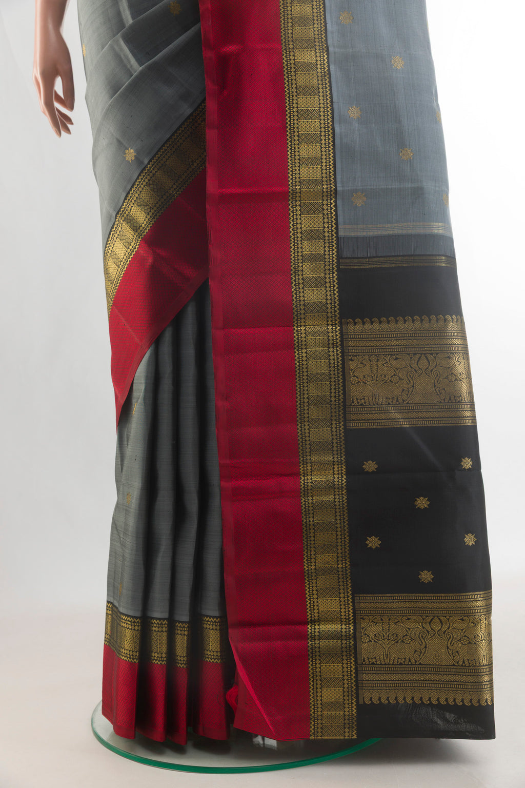 Pleats and pallu of Pure Silk Pure Zari Grey Kanjivaram Saree with Zari Butta on the body and Zari Border. 
