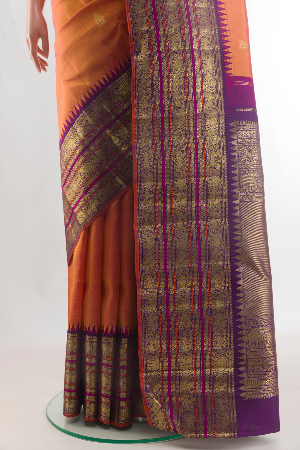 Pleats and pallu of Pure Silk Pure Zari Brick Orange Kanjivaram Saree with Zari Butta on the body and Zari Border. 