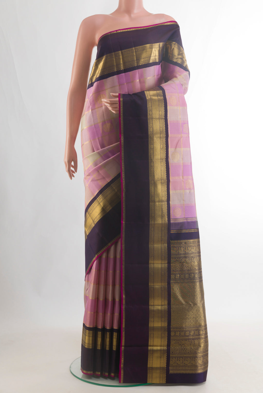 Pure Silk Pure Zari Pink Kanjivaram Saree with Checked design on the body and Zari Border.  displayed on a mannequin