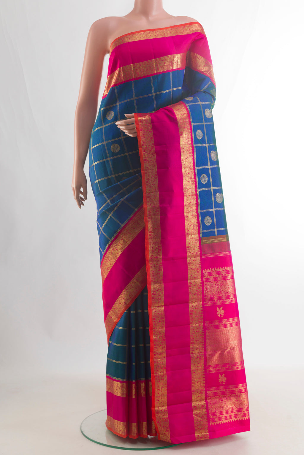 Pure Silk Pure Zari Blue Kanjivaram Saree with Checked design on the body and Zari Border.  displayed on a mannequin