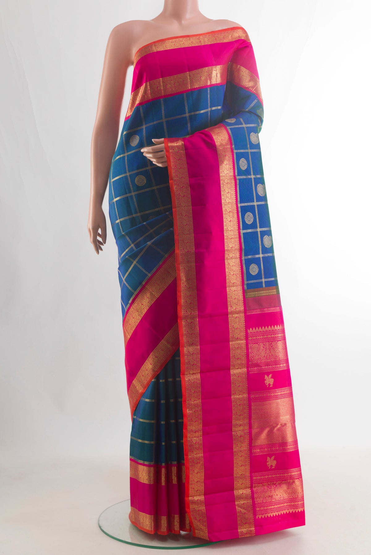 Pure Silk Pure Zari Blue Kanjivaram Saree with Checked design on the body and Zari Border.  displayed on a mannequin
