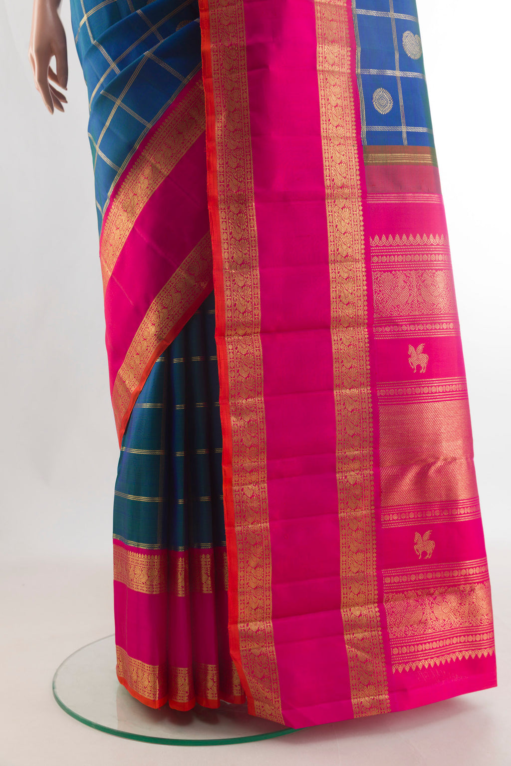 Pleats and pallu of Pure Silk Pure Zari Blue Kanjivaram Saree with Checked design on the body and Zari Border. 