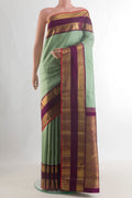 Pure Silk Pure Zari Light Green Kanjivaram Saree with Checked design on the body and Zari Border.  displayed on a mannequin