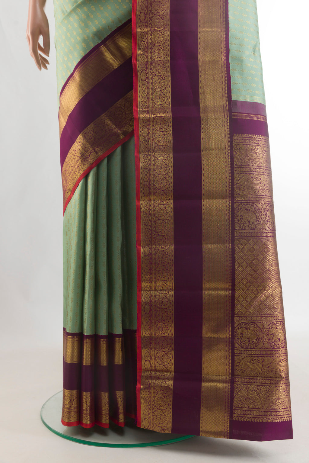 Pleats and pallu of Pure Silk Pure Zari Light Green Kanjivaram Saree with Checked design on the body and Zari Border. 