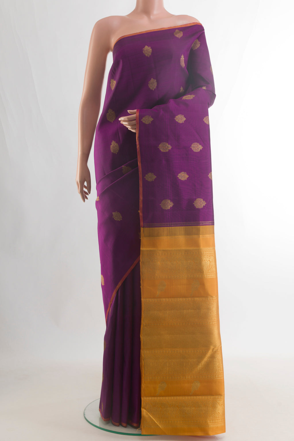 Pure Silk Pure Zari Purple Kanchipuram Saree with Zari Butta on the body and Without Border.  displayed on a mannequin