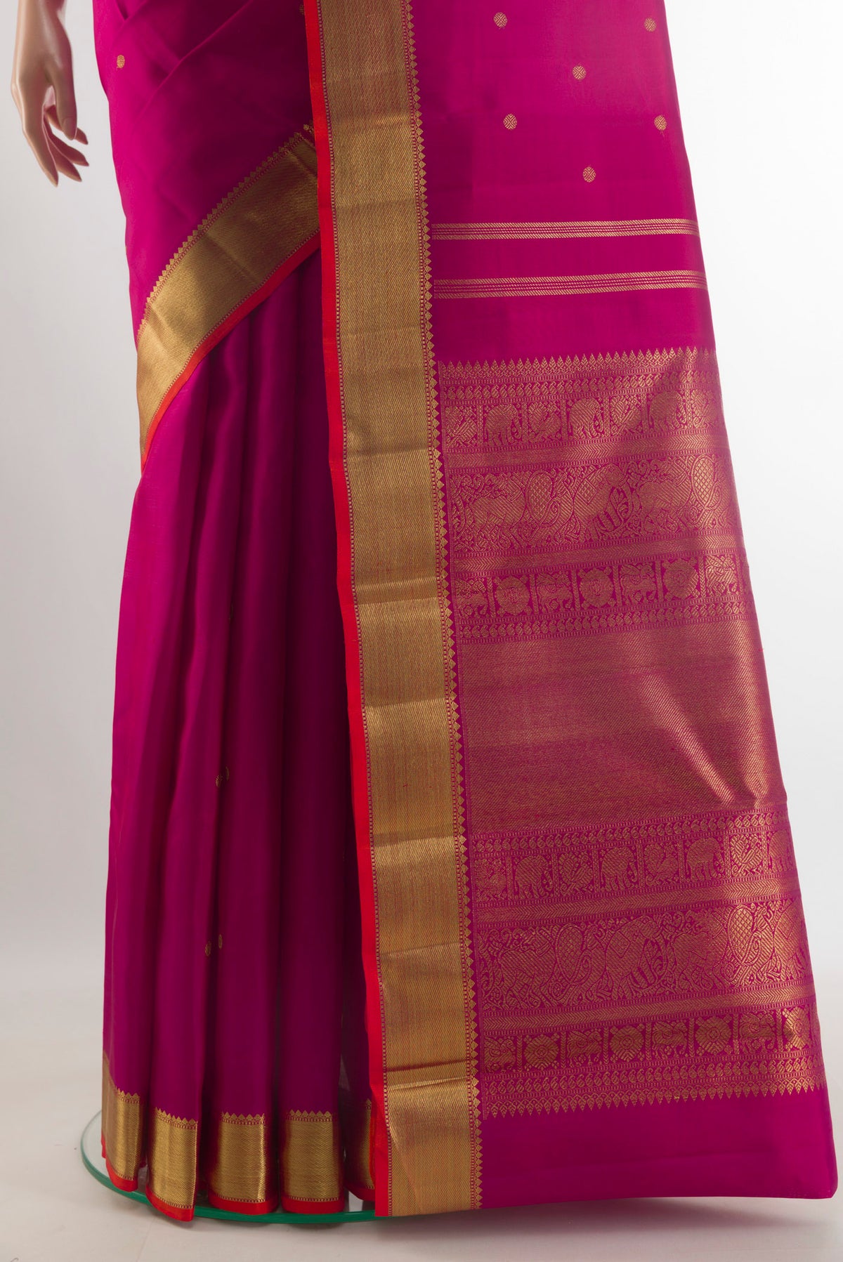 Pleats and pallu of Pure Silk Pure Zari Dark Pink Kanjivaram Saree with Zari Butta on the body and Zari Border. 