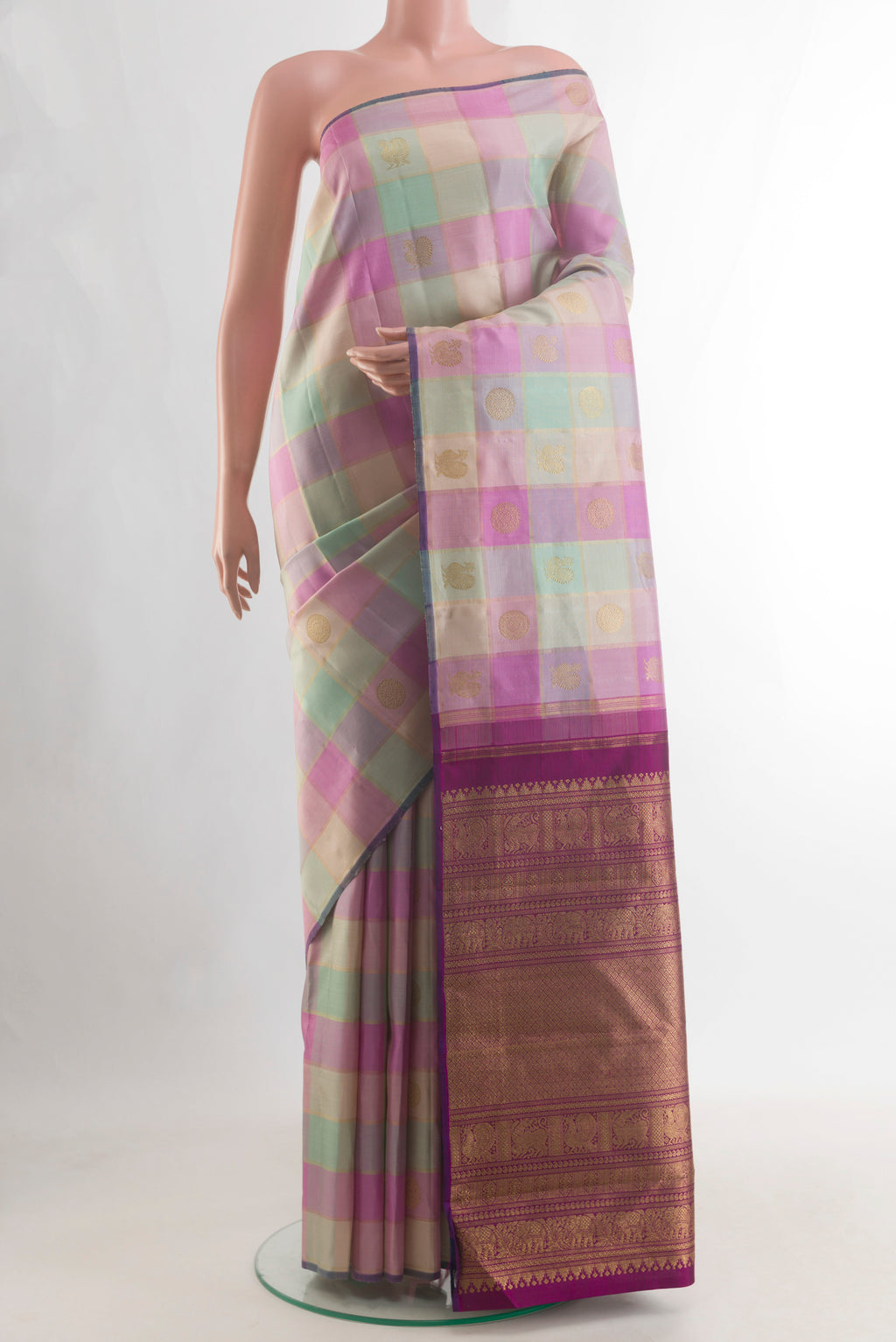 Pure Silk Pure Zari Multi Color Kanjivaram Saree with Checked design on the body and Without Border.  displayed on a mannequin