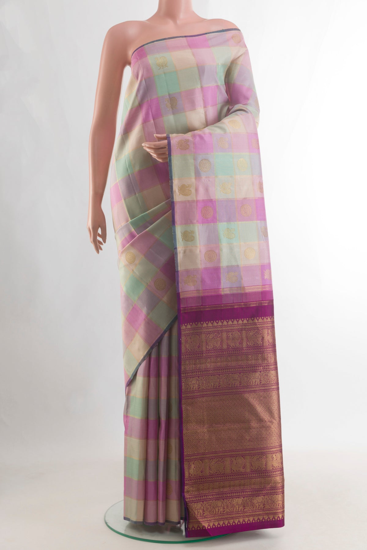 Pure Silk Pure Zari Multi Color Kanjivaram Saree with Checked design on the body and Without Border.  displayed on a mannequin