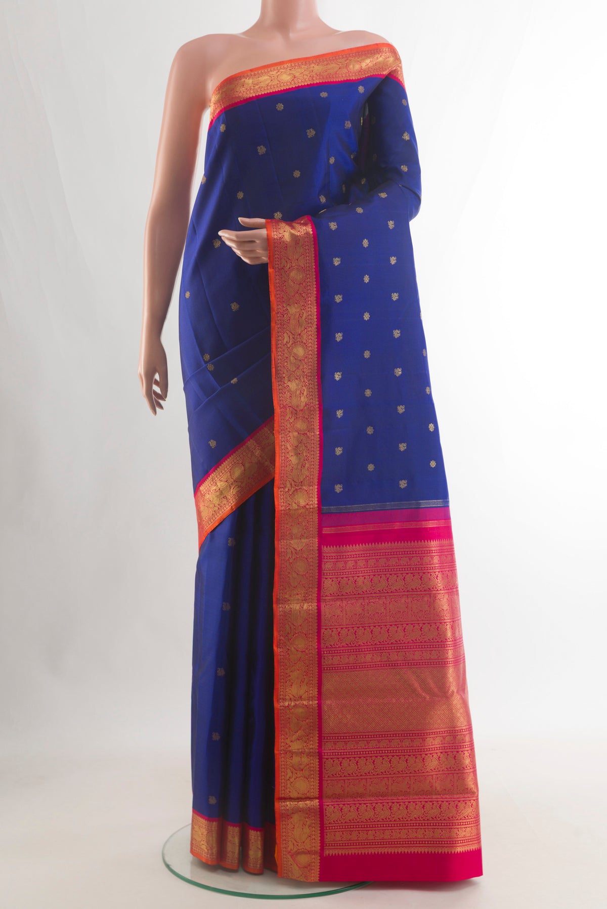 Pure Silk Pure Zari Blue Kanjivaram Saree with Zari Butta on the body and Zari Border.  displayed on a mannequin