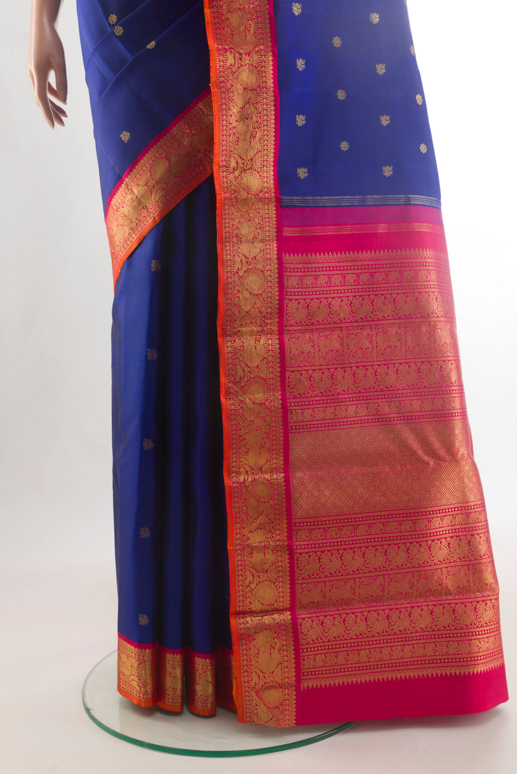 Pleats and pallu of Pure Silk Pure Zari Blue Kanjivaram Saree with Zari Butta on the body and Zari Border. 